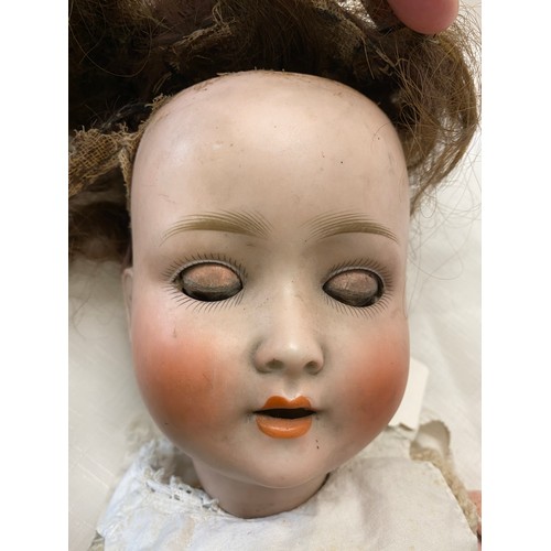 713 - Schoenau and Hoffmeister 1909 bisque headed doll with brown sleeping eyes and open mouth.  60cm h.