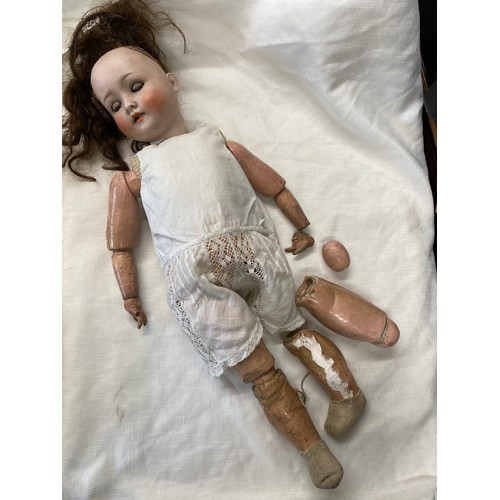 713 - Schoenau and Hoffmeister 1909 bisque headed doll with brown sleeping eyes and open mouth.  60cm h.