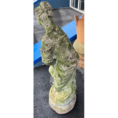 1359A - A reconstituted stone female figure. 84cm h.