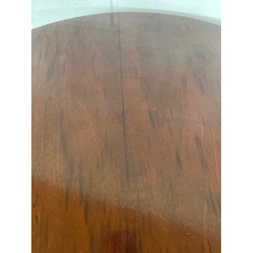 174 - A tilt top mahogany table. 83cm d.