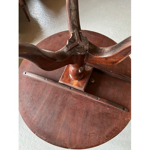 174 - A tilt top mahogany table. 83cm d.