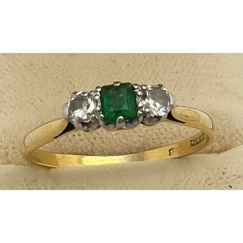 634 - An 18ct gold ring set with emerald and diamonds . Size P. Weight 3.9gm.