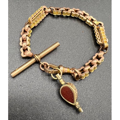 646 - A 19thC yellow metal chain with T Bar together with key fob. Chain test as 9ct gold .  Weight of cha... 