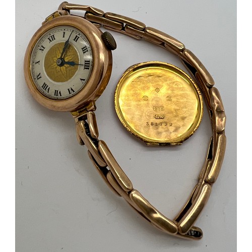 922 - A 9ct gold ladies wristwatch with expanding bracelet marked 9ct. Winds and ticks. 18.2gm total.