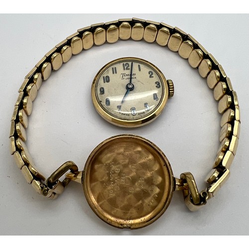 923 - A 9ct gold Timor ladies wristwatch on expanding rolled gold bracelet. Winds and ticks.