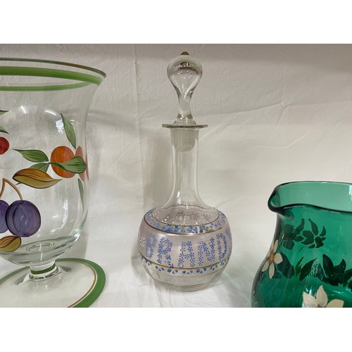 476 - A selection of coloured and hand painted glass ware to include: 3 x cranberry jugs, 3 x green jugs a... 