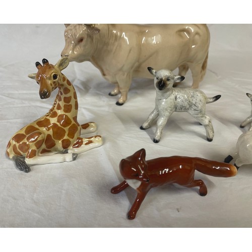 417 - Six Beswick animal figurines to include: cream bull 23cm l, giraffe, 2 x lambs 5cm and 8cm h, fox an... 