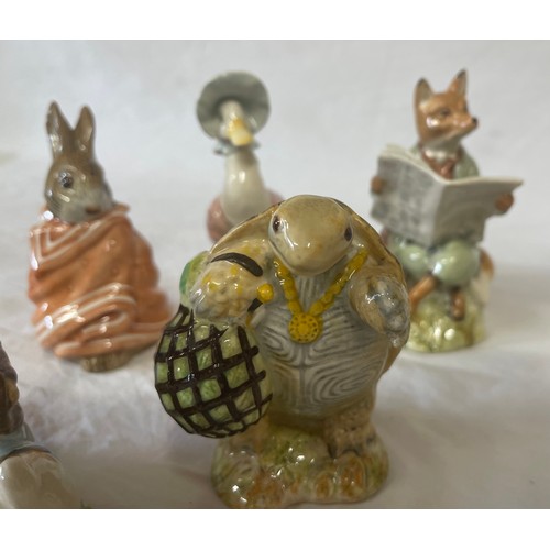 418 - Nine animal figurines to include Royal Albert Beatrix Potter Jemima Puddle Duck 10.5cm h, Foxy Readi... 