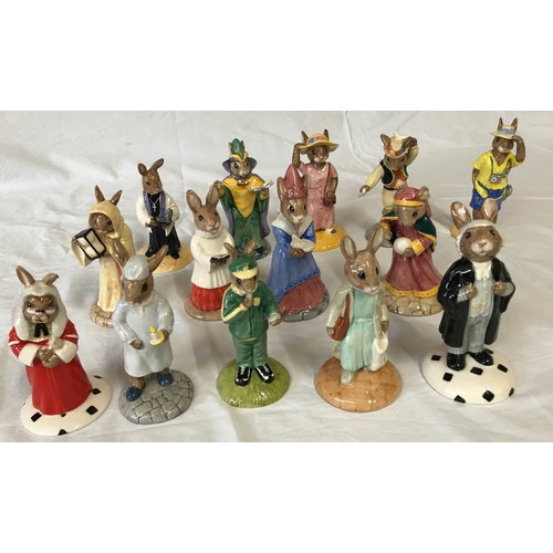 424 - A collection of Royal Doulton 'Bunnykins' to include: Shopper, Fortune Teller, Lawyer, Tourist, Morr... 