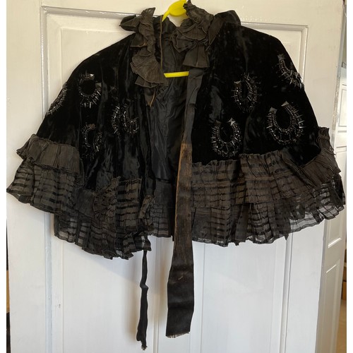 732 - A collection of vintage capes and tops to include 1 x black silk cape with white embroidered flowers... 