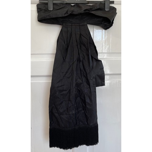 735 - A black Victorian long overskirt with black and white checked silk apron pinny together with a small... 