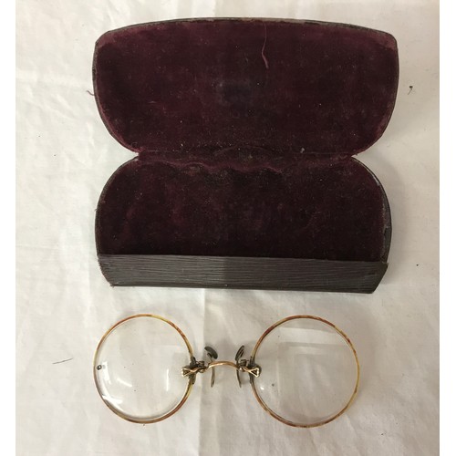 750 - Six pairs of spectacles, four in cases and one pair of pince nez in a case.