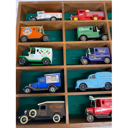 970 - Two glazed cases of 30 various vans etc to include Lledo, Days Gone, Corgi and Matchbox.