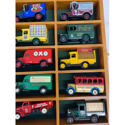 970 - Two glazed cases of 30 various vans etc to include Lledo, Days Gone, Corgi and Matchbox.