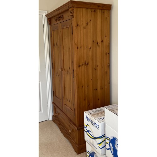 158 - A pine 2 door wardrobe. 200 h x 118 w x 60cm d.