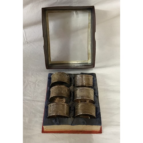 867 - Set of six white metal Chinese napkin rings depicting dragons, total weight 131.2gm. In presentation... 