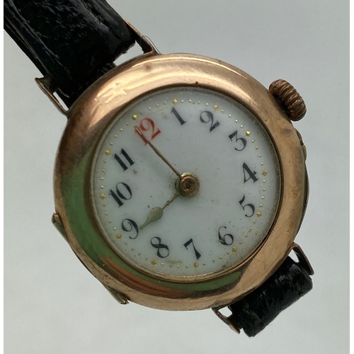 930 - A ladies 9ct gold wristwatch with leather strap. Marked 375 GS 481782.