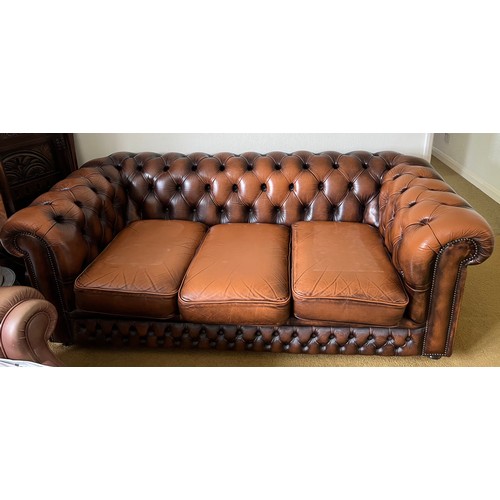 148 - A brown leather button backed sofa 187 l x 87cm d.