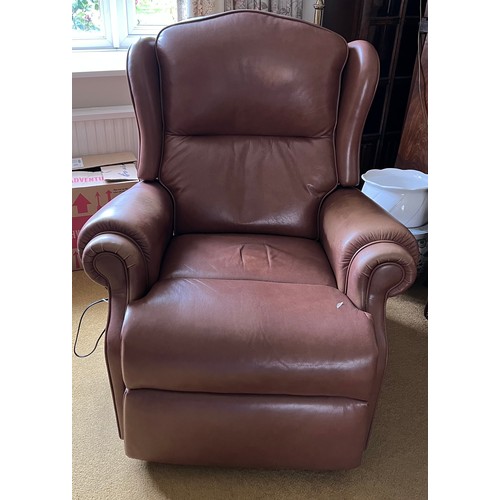 151 - Two electrically operated brown leather reclining chairs.