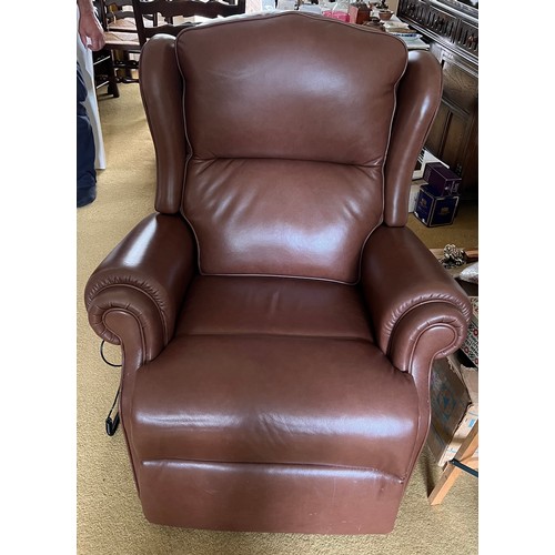 151 - Two electrically operated brown leather reclining chairs.