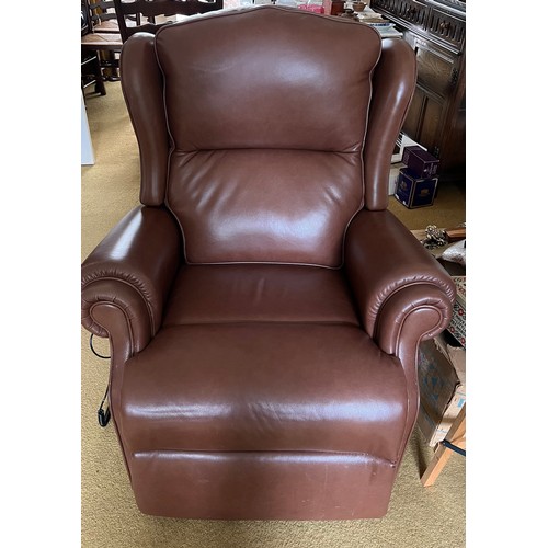 151 - Two electrically operated brown leather reclining chairs.