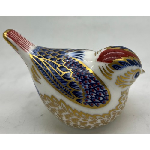 443 - A Royal Crown Derby bird paperweight with gold stopper.