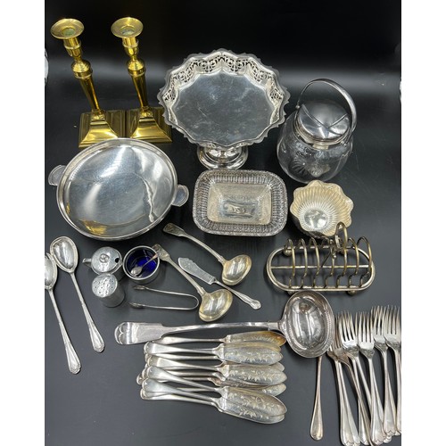 771A - A quantity of silver plated items with a pair of brass candlesticks to include fish knives and forks... 