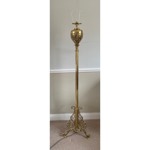 1069 - A brass standard oil lamp converted to electric. 150cm h.