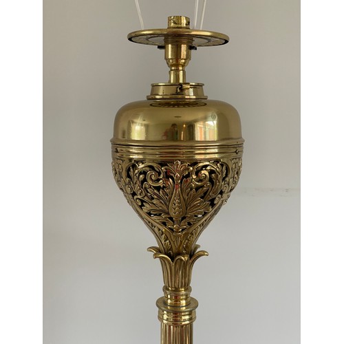 1069 - A brass standard oil lamp converted to electric. 150cm h.