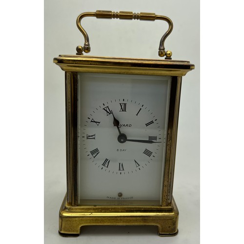 1044 - A brass cased carriage clock by Duverdrey & Bloquel with Roman numerals. 11 5cm h. Winds and goes.