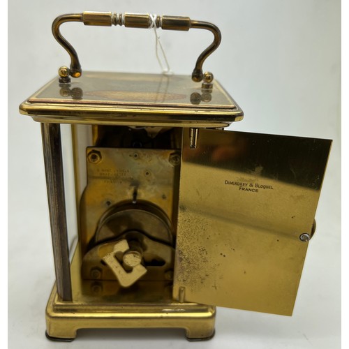 1044 - A brass cased carriage clock by Duverdrey & Bloquel with Roman numerals. 11 5cm h. Winds and goes.