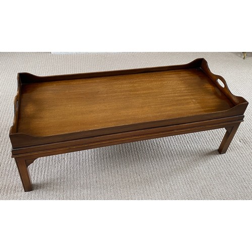 194 - A mahogany coffee table galleried tray top. 42 h x 52 w x 123cm l.