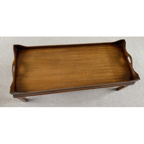 194 - A mahogany coffee table galleried tray top. 42 h x 52 w x 123cm l.