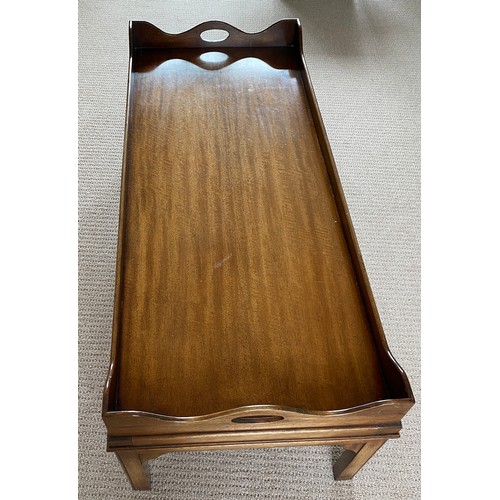 194 - A mahogany coffee table galleried tray top. 42 h x 52 w x 123cm l.