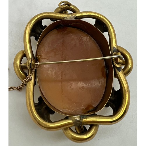 652 - A 19thC carved shell cameo brooch with safety chain.