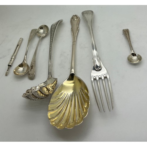 838 - Silver cutlery to include a pair of Georgian salt spoons, Victorian salt spoon, Victorian sifter spo... 