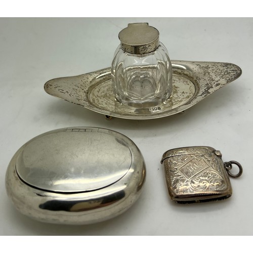 840 - A silver and glass inkwell on stand London 1901, a snuff box Birmingham 1920 maker Robert Chandler a... 