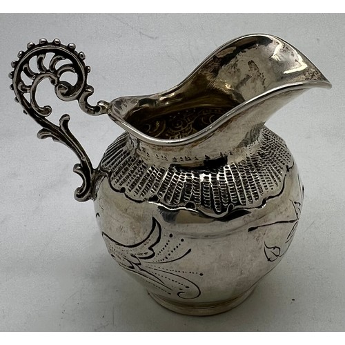 842 - Continental silver cream jug 6cm h, 42gm. Import marks for London 1896.