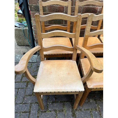 175D - Eight Acorn Man wavy ladder back dining chairs to include 2 carvers, all with leather seats.