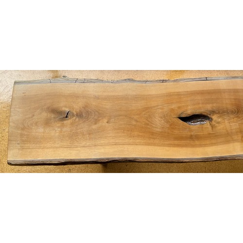 186 - Wooden bench constructed from planks of wood with bark remaining. 191cms l x 30cms w x 39cms h.