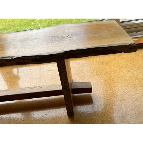 186 - Wooden bench constructed from planks of wood with bark remaining. 191cms l x 30cms w x 39cms h.