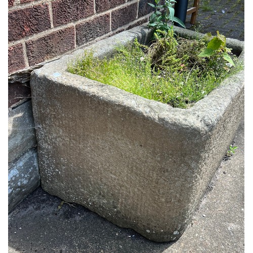 211A - A stone trough 80cms w x 53cms d x 46cms h.