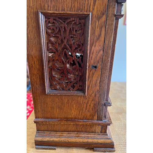 1045 - Well craved oak chiming bracket clock retailed by G.Whitfield, works marked Lenzkirch A G U 1 millio... 