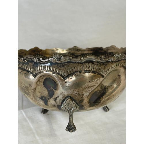 859 - Two Continental silver items to include a tri-foot bowl with pressed design, AR 800 marked to inside... 