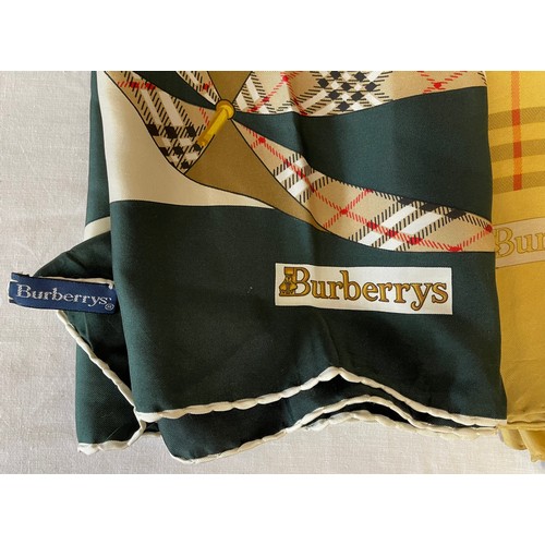 753 - A collection of seven Silk scarf to include 2 x Burberry with the classic check pattern, 2 x Liberty... 