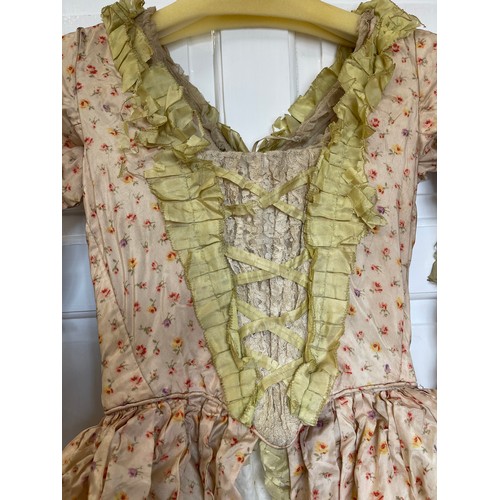 755 - An 1840's Georgian ladies dress with bonnet made by L&H Nathan 12 Panton Street, Haymarket, London. ... 