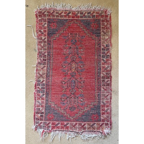 1124 - A woven prayer rug mostly red hues 48cms w x 86cms l.