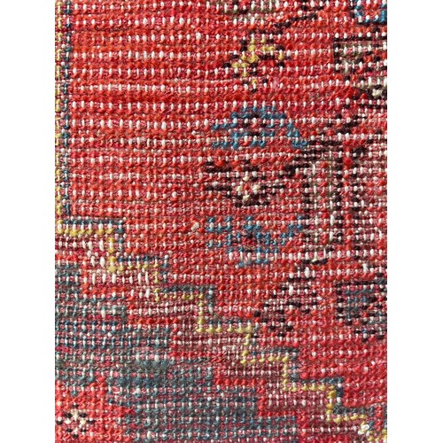 1124 - A woven prayer rug mostly red hues 48cms w x 86cms l.