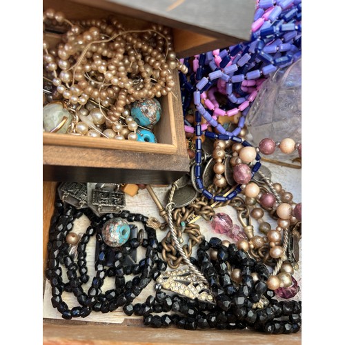 531 - A large quantity of vintage costume jewellery, jewellery and scent bottle boxes to include beads, br... 