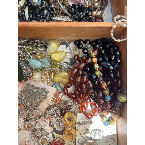 531 - A large quantity of vintage costume jewellery, jewellery and scent bottle boxes to include beads, br... 